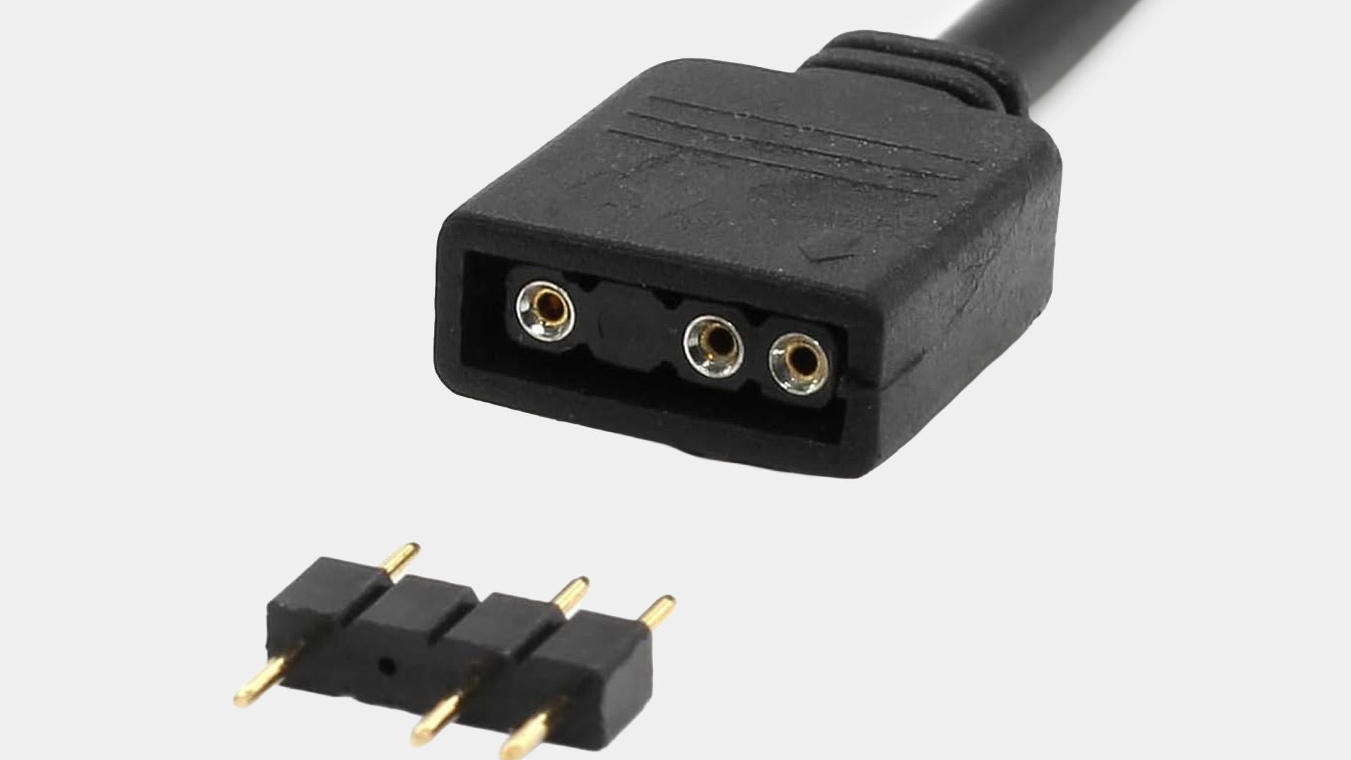 Close-up view of a 3-pin 5V ARGB connector plug alongside a pin adapter.