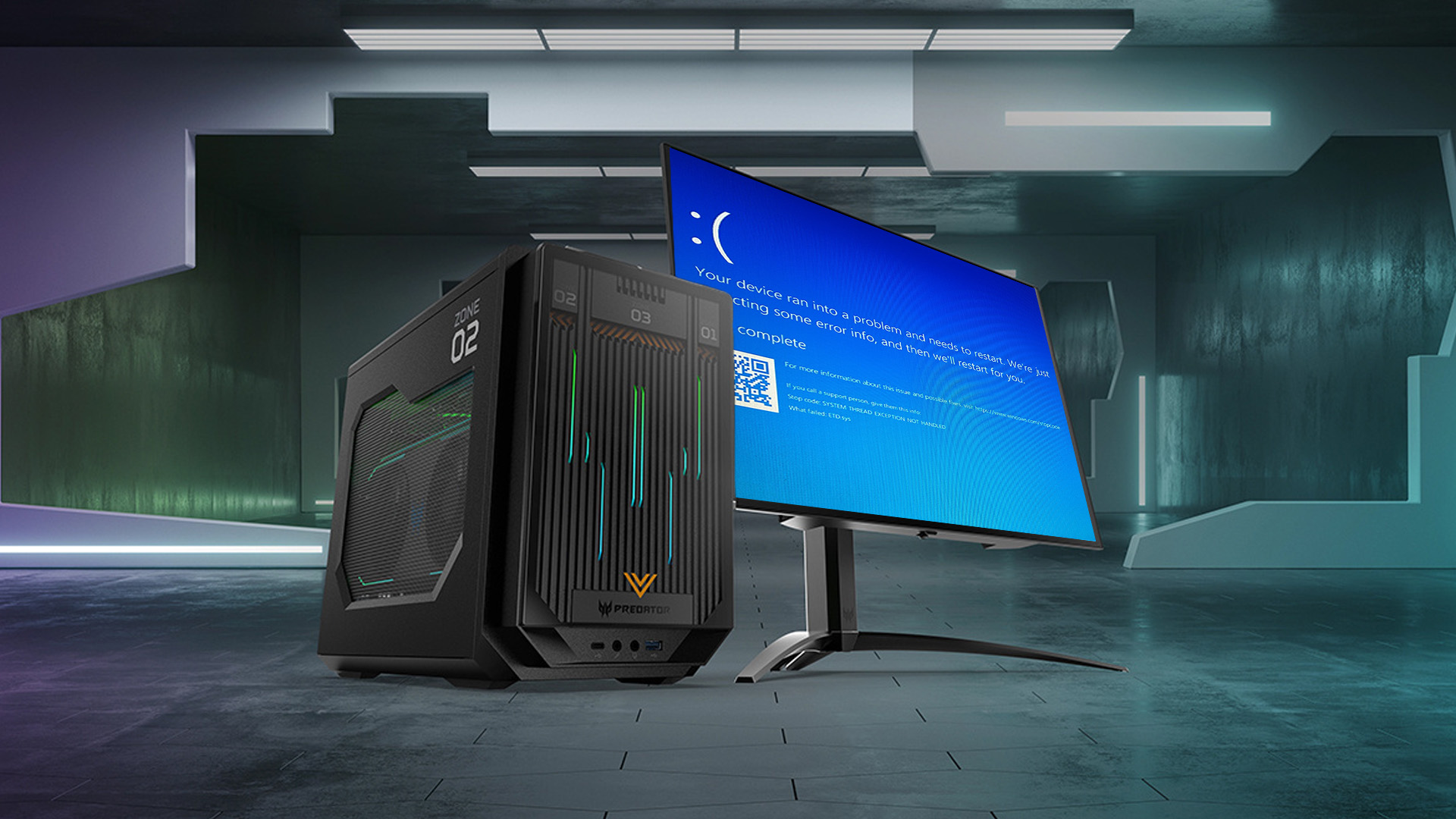 Acer Predator gaming desktop next to a monitor with BSOD error.