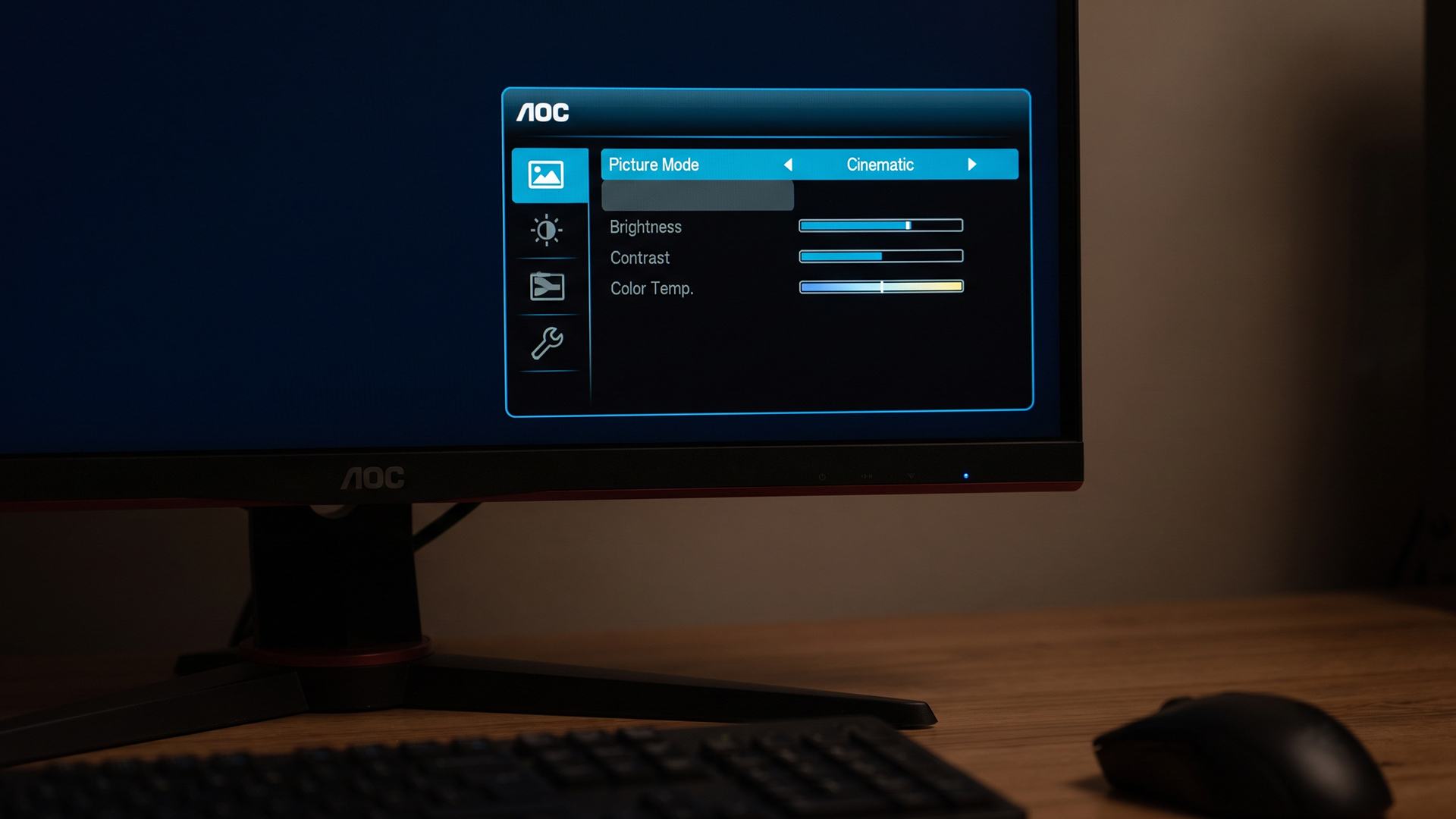 Close-up of an AOC gaming monitor displaying its on-screen display menu with picture mode options.