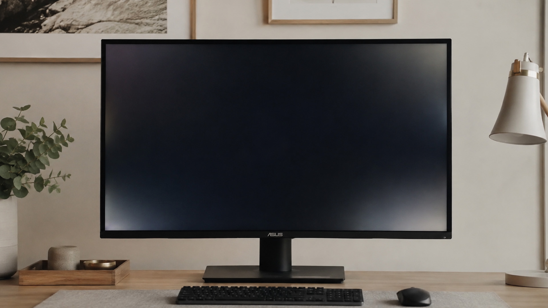 ASUS IPS monitor on a wooden desk showing faint IPS glow on a dark screen.