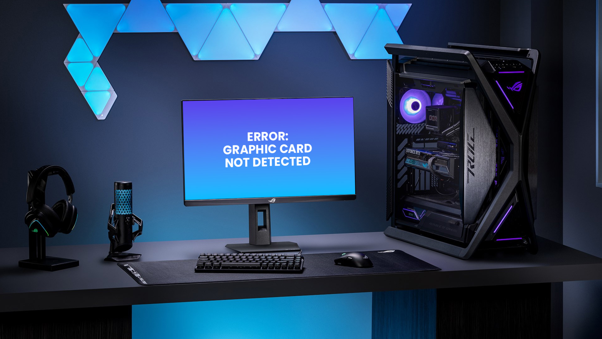 An ASUS ROG gaming desktop and monitor setup displaying a 'Graphic Card Not Detected' error message on screen.