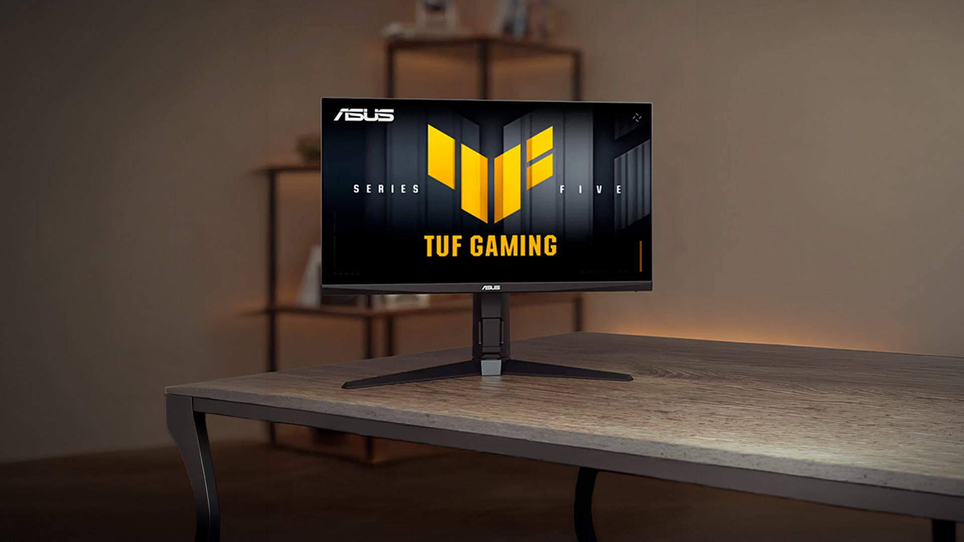 Front view of the ASUS VG27AQM5F 27-inch QHD gaming monitor on a desk.