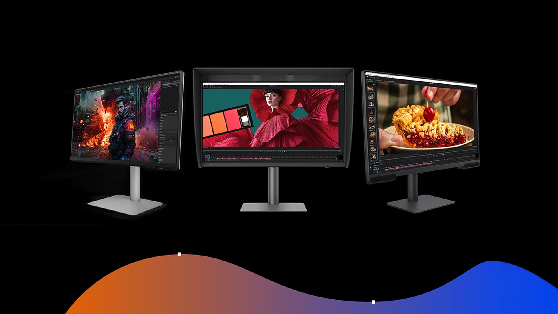 Multiple BenQ design monitors displaying creative work and photography.