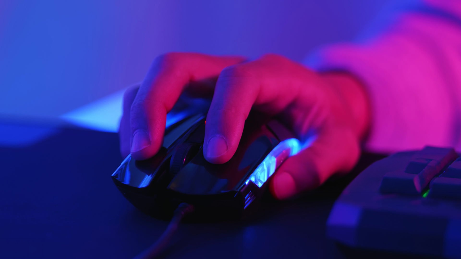 Close-up of a person's hand using a high-performance gaming mouse.