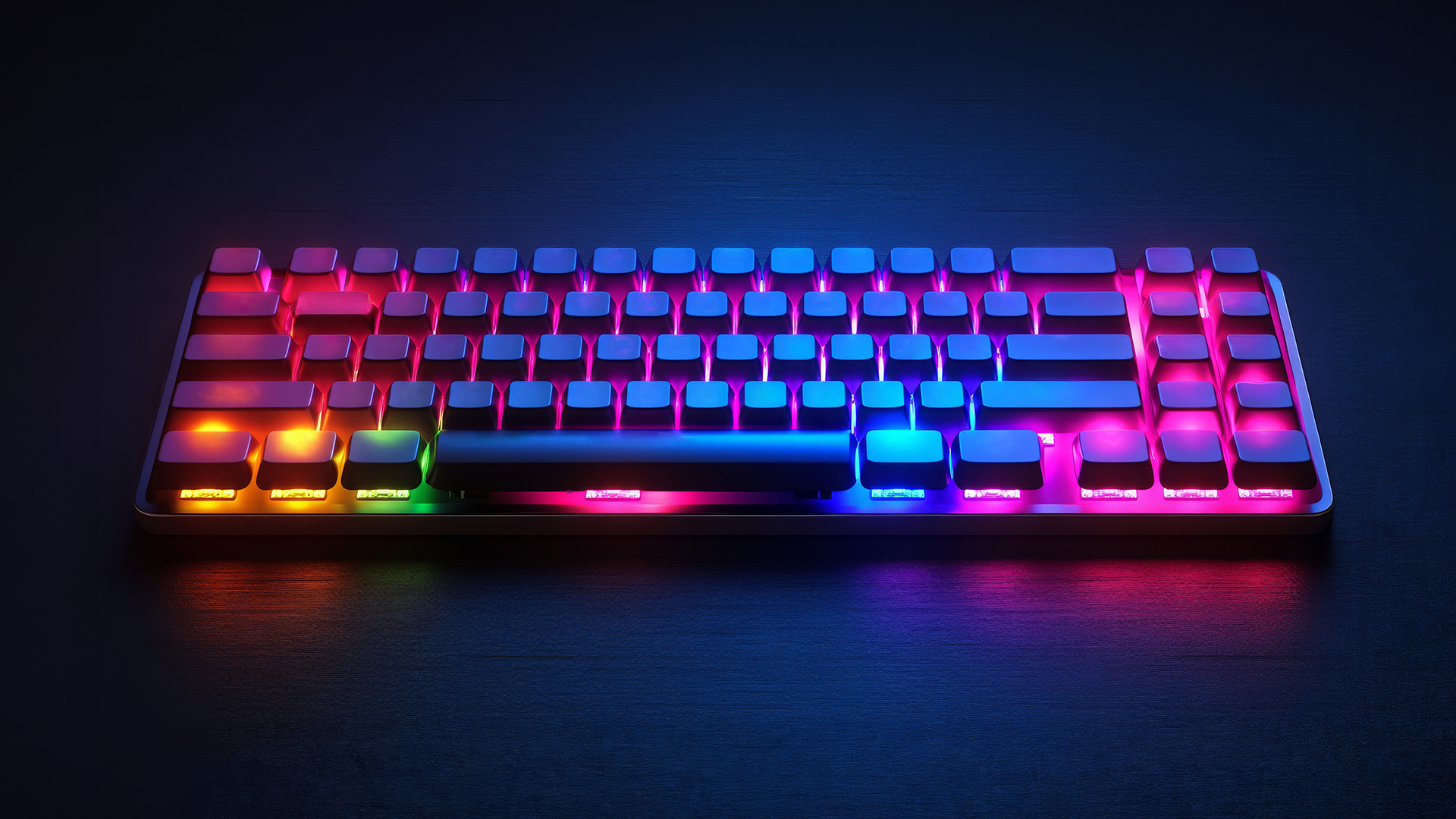 Compact mechanical gaming keyboard glowing with vibrant RGB colors on a desk.