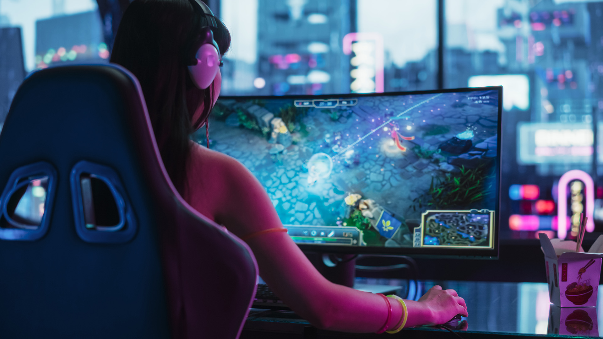 A woman playing an RPG on a curved gaming monitor in a dark room.