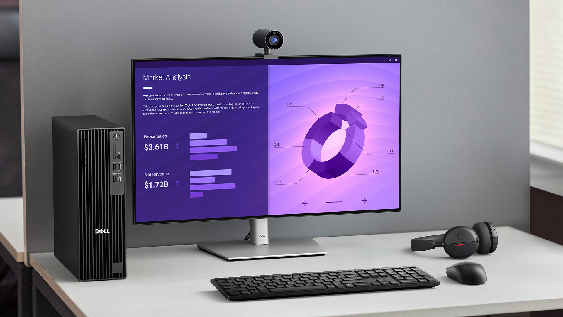 A modern office workspace featuring a Dell business desktop PC, monitor, and wireless headset.