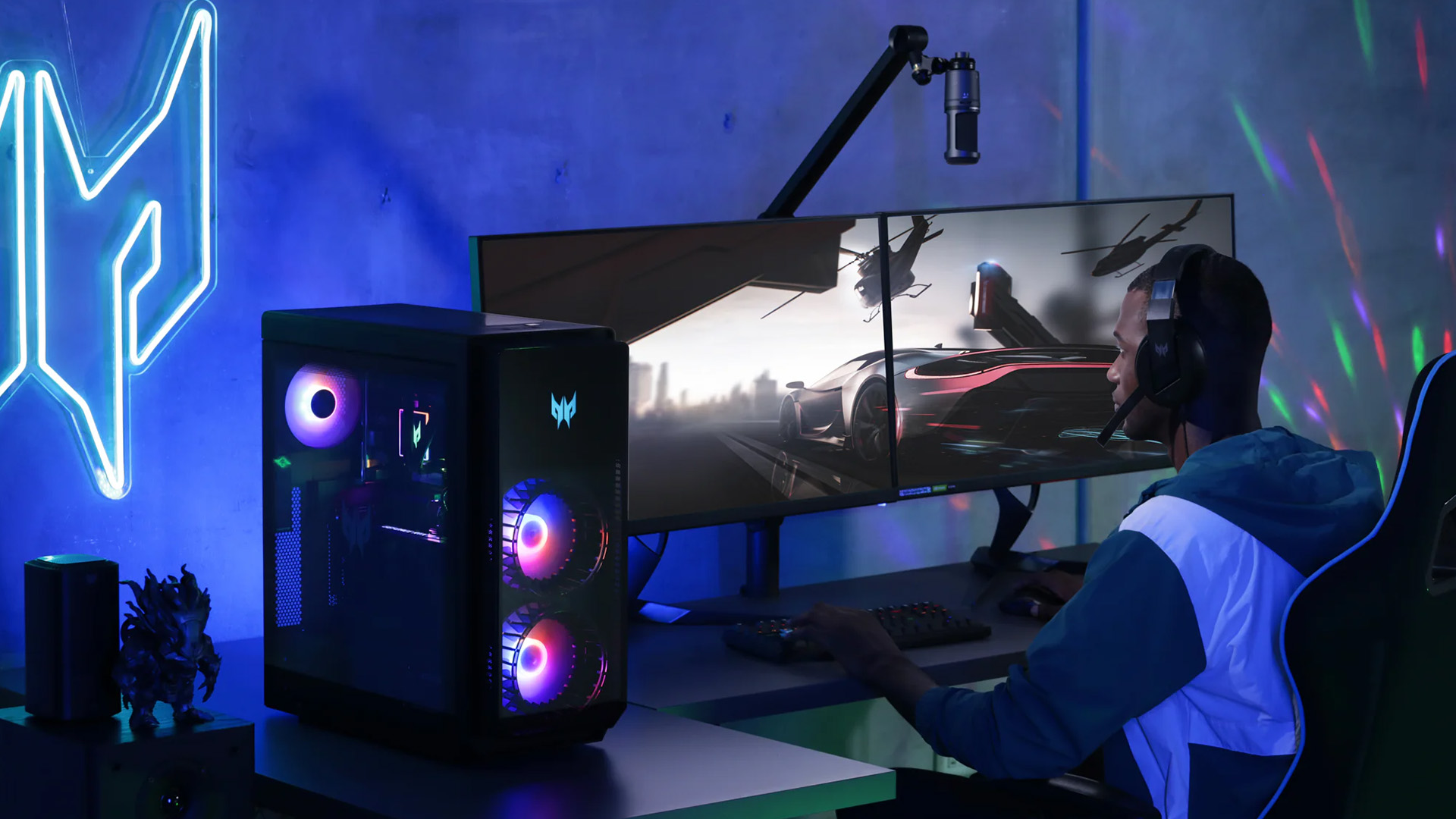 Gamer using dual monitors with an Acer Predator gaming PC.