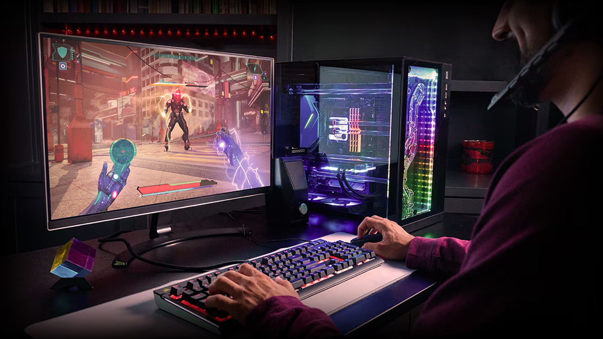 Gamer wearing a headset playing Cyberpunk on an illuminated AMD gaming desktop.