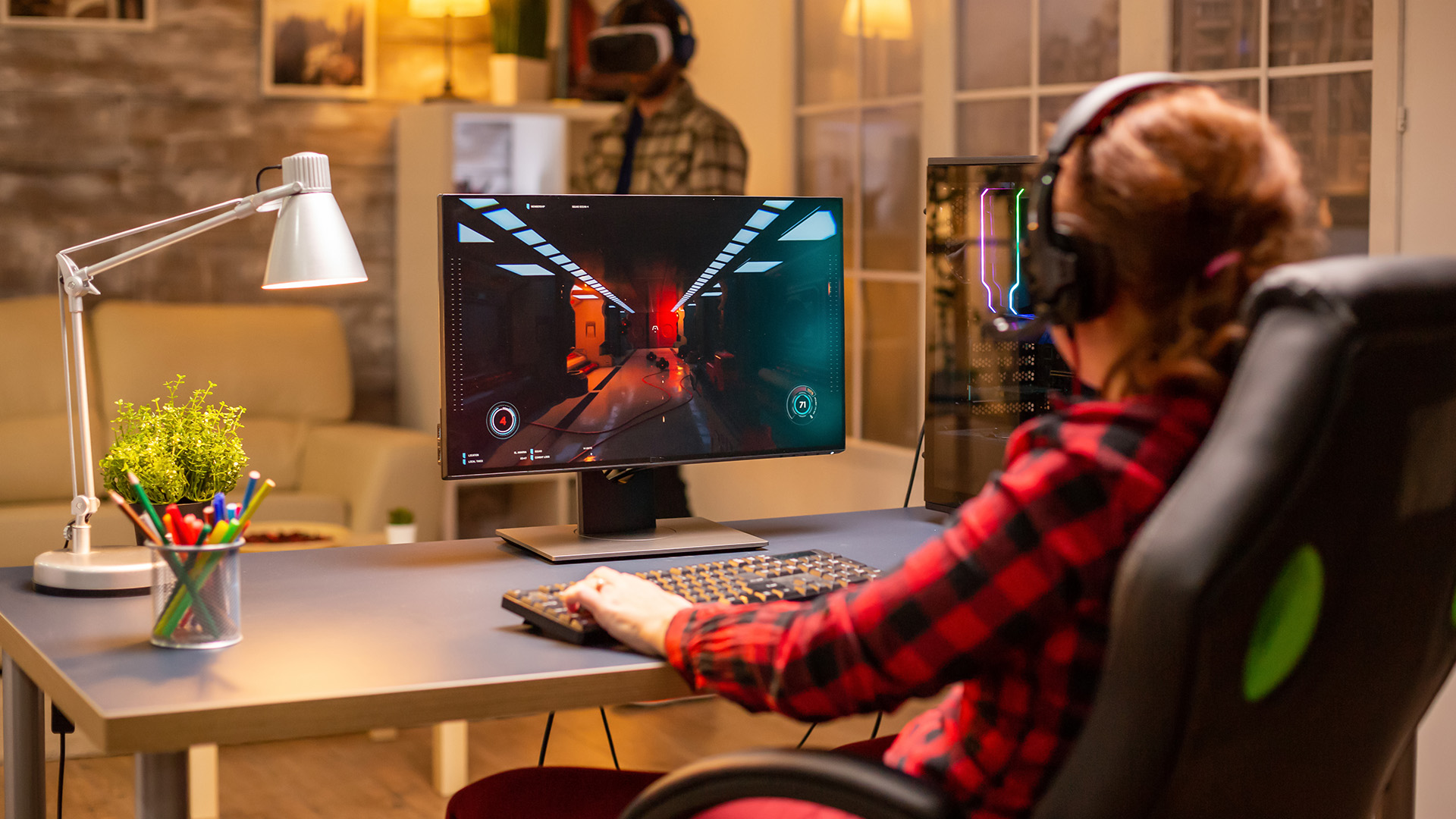 Gamer using a 27-inch monitor for fast-paced FPS gaming.