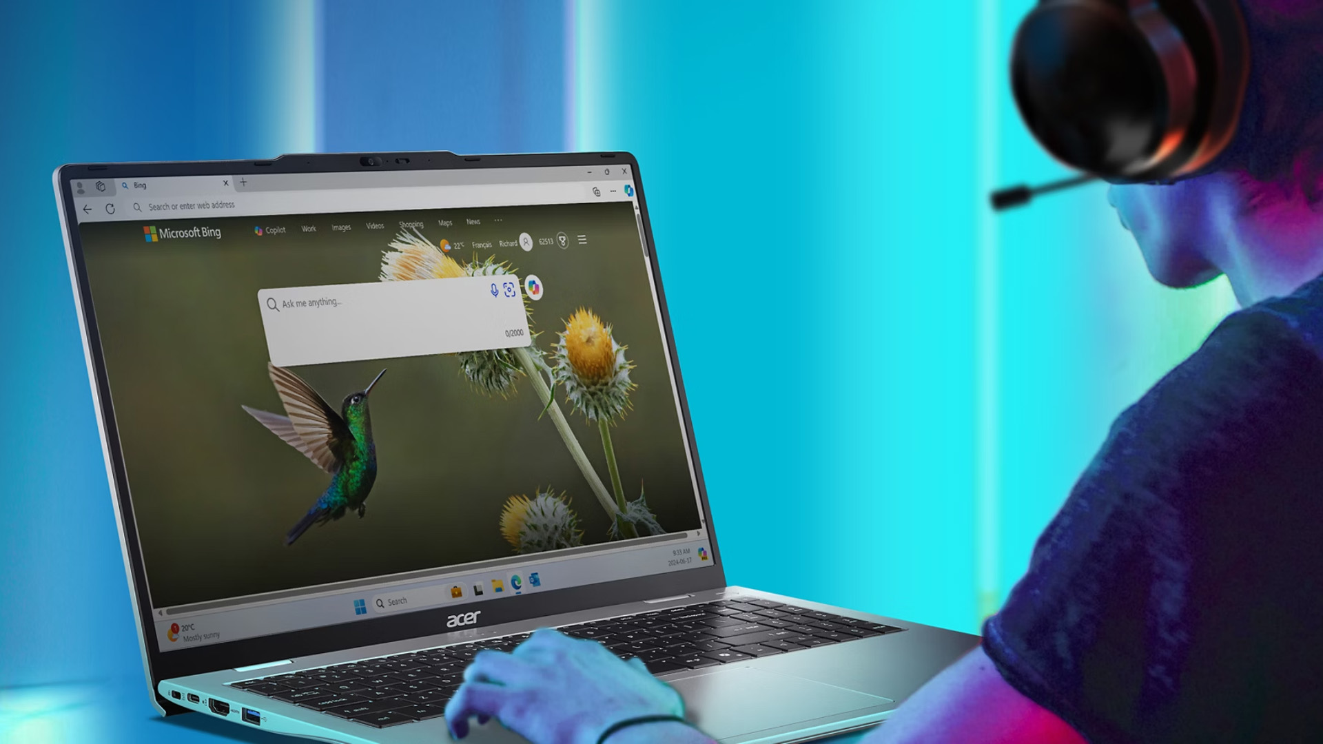 Person wearing a headset using an Acer laptop displaying the Bing search homepage.