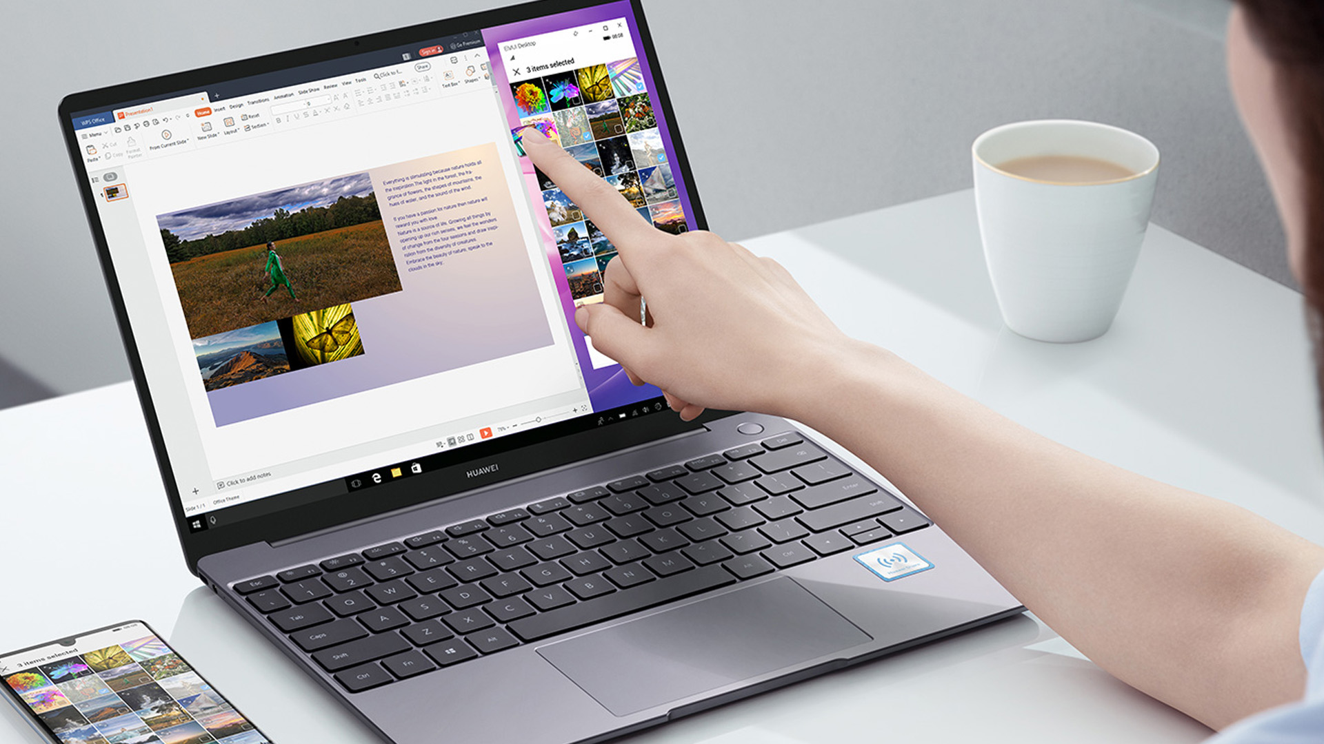 Person using Huawei MateBook 13 touchscreen to drag photos alongside a connected smartphone.