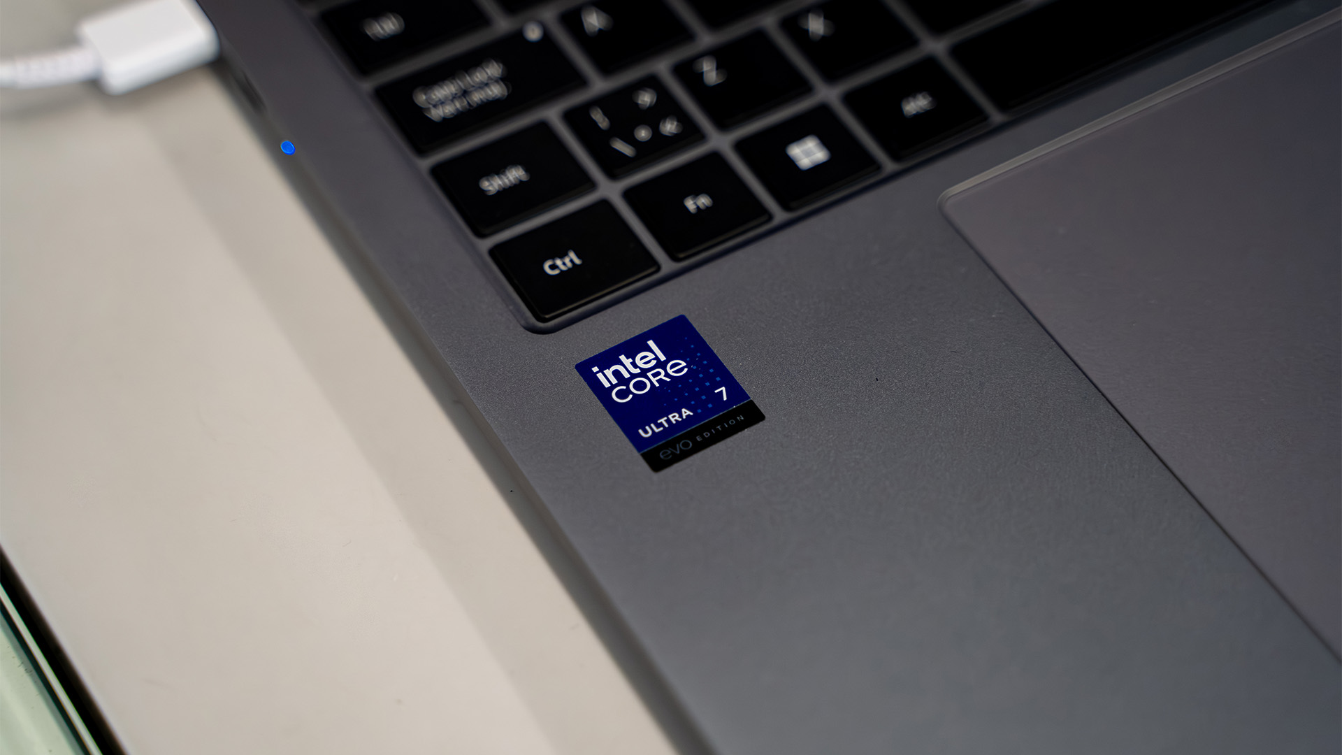 Close-up of an Intel Core Ultra 7 Evo Edition sticker on a laptop palm rest.