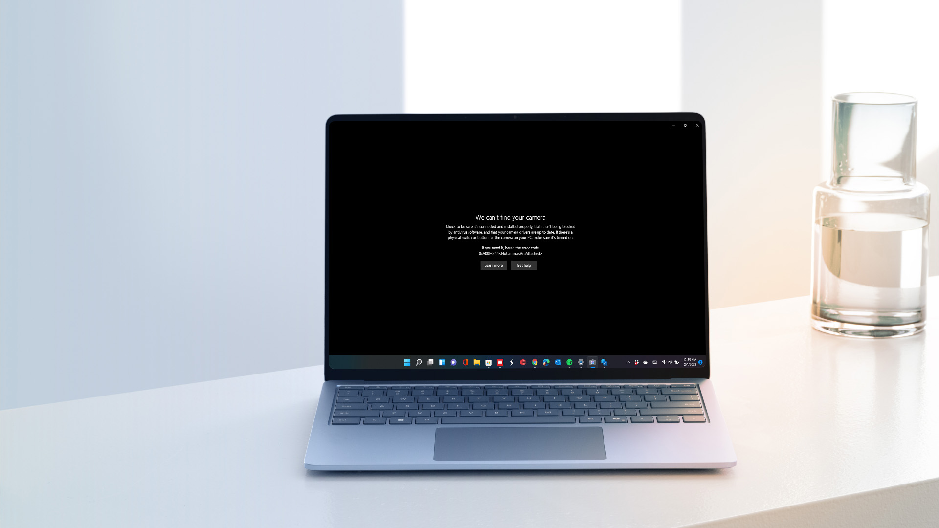 A laptop screen displaying a camera error message in Windows.