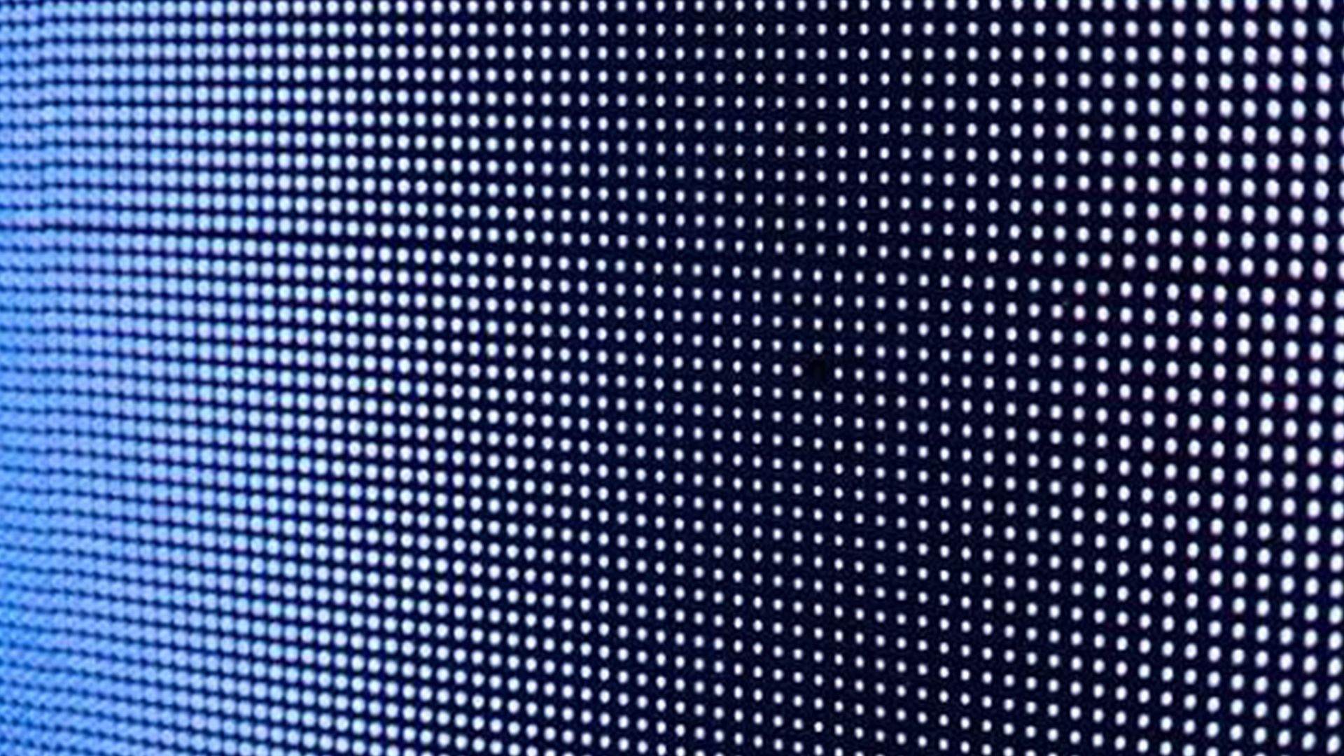 A close-up view of an LCD monitor's pixel grid pattern.