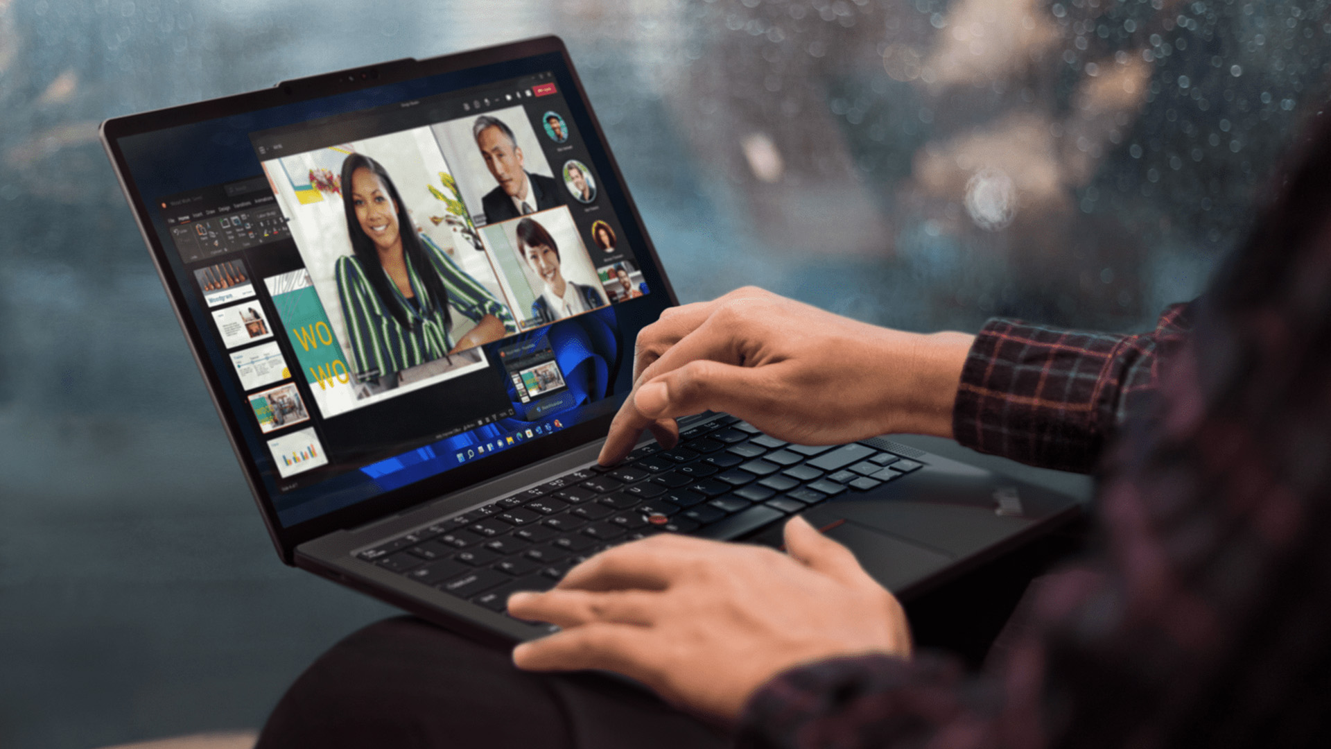 Remote worker using a Lenovo ThinkPad X13 Gen 7 for a video meeting on their lap.