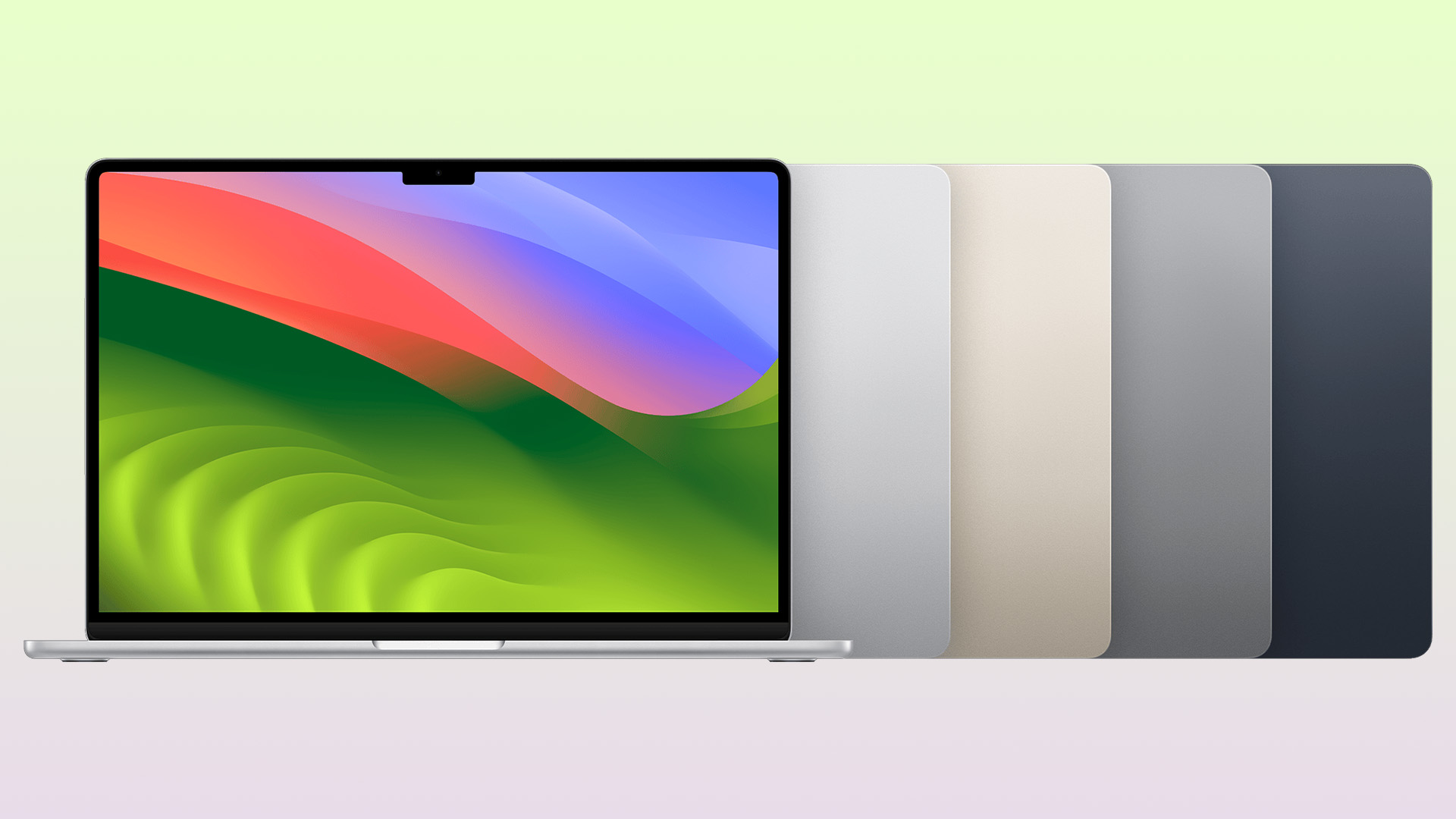 MacBook Air laptops lined up showing different color finishes and open screen.