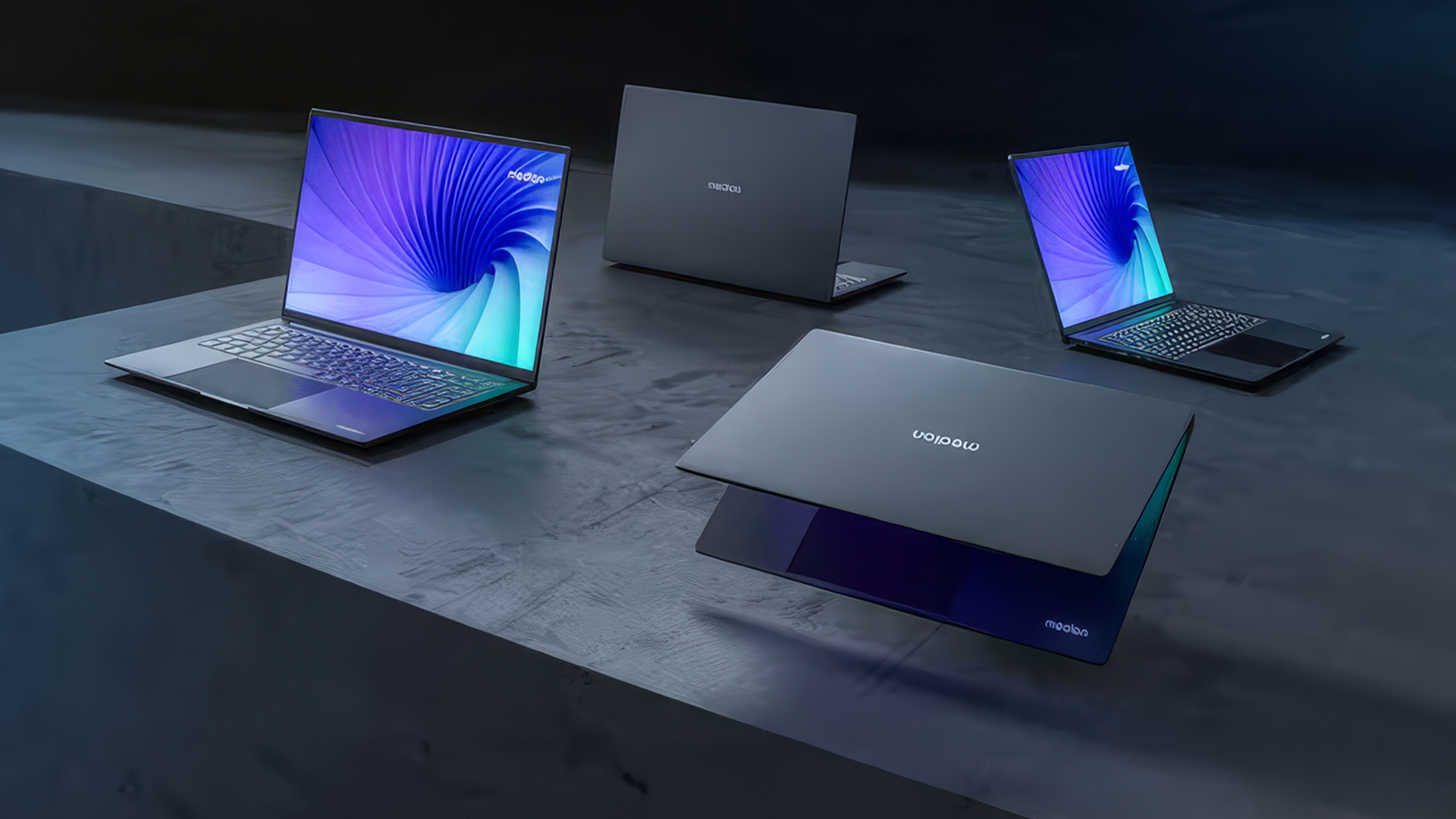 Multiple Medion laptops arranged on a sleek dark table surface.