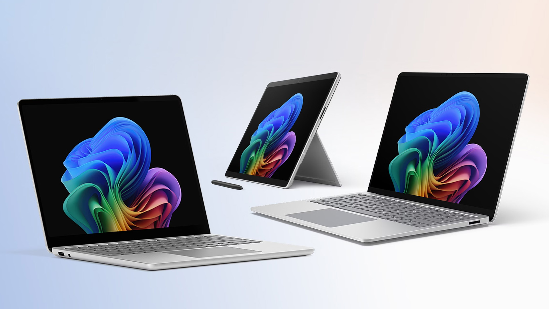 Microsoft Surface Pro tablet and laptops displayed against a clean light background.