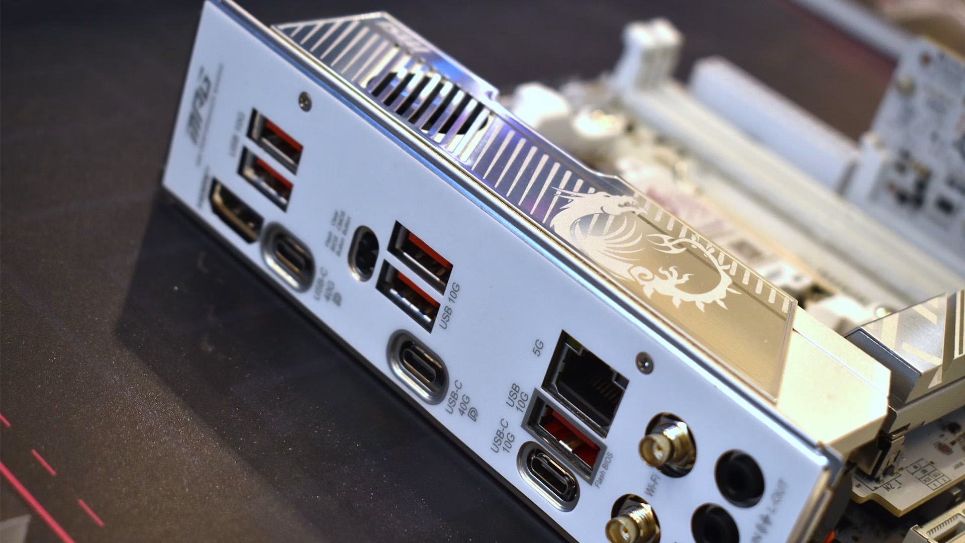 A detailed view of a modern motherboard I/O shield with various USB and Type-C ports.