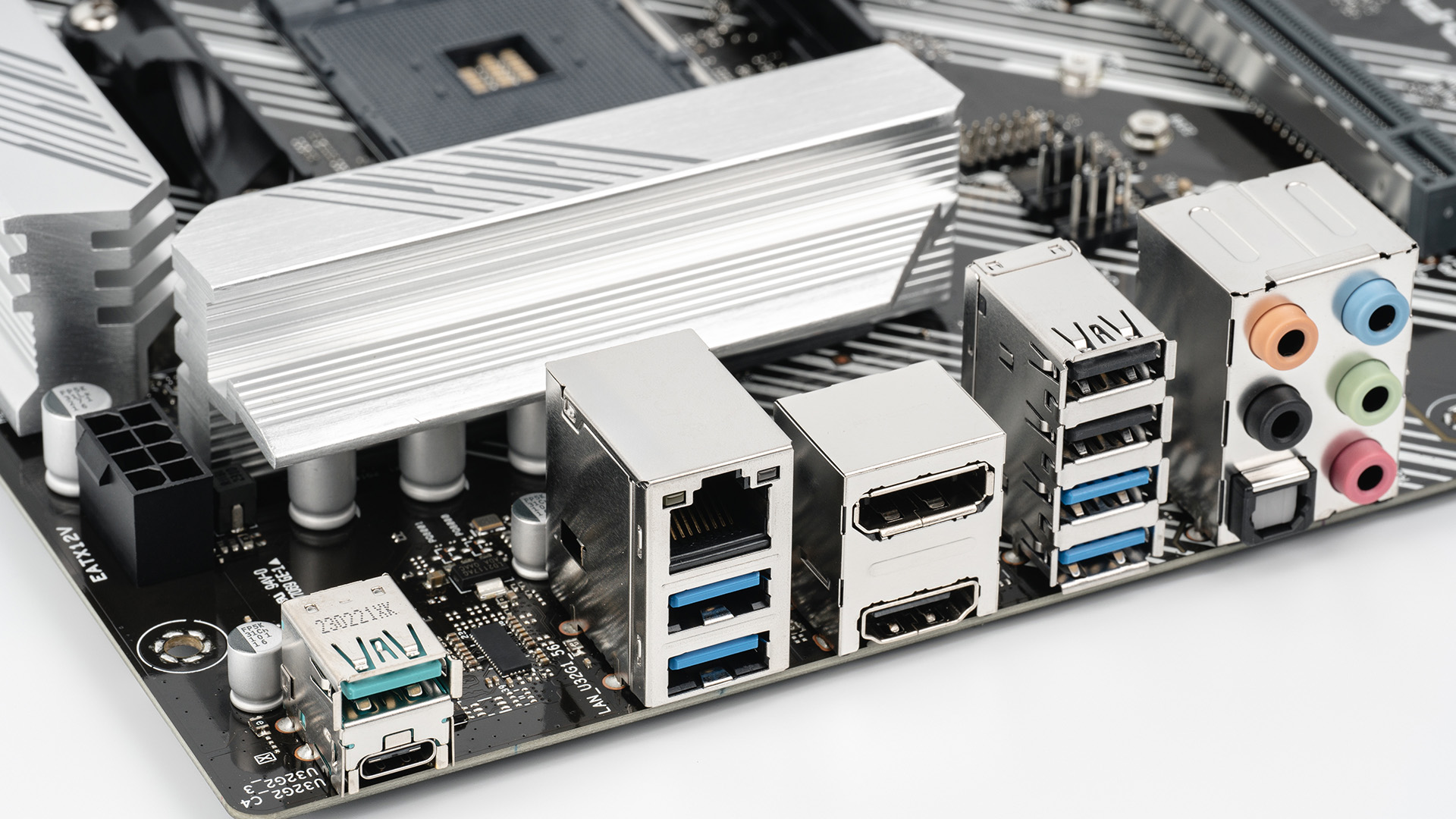 A close-up view of a motherboard rear I/O panel featuring multiple USB ports and audio jacks.