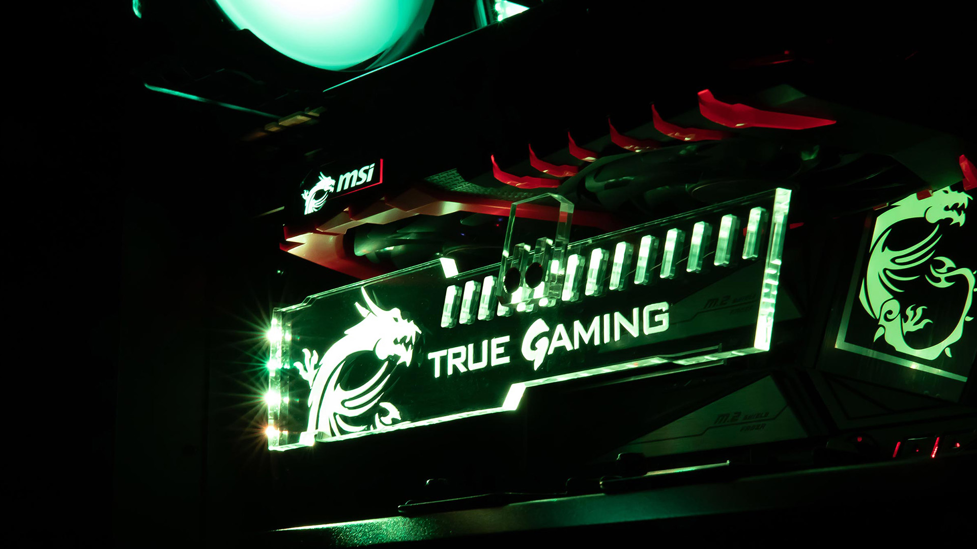 An illuminated MSI graphics card support bracket installed inside a gaming PC case.