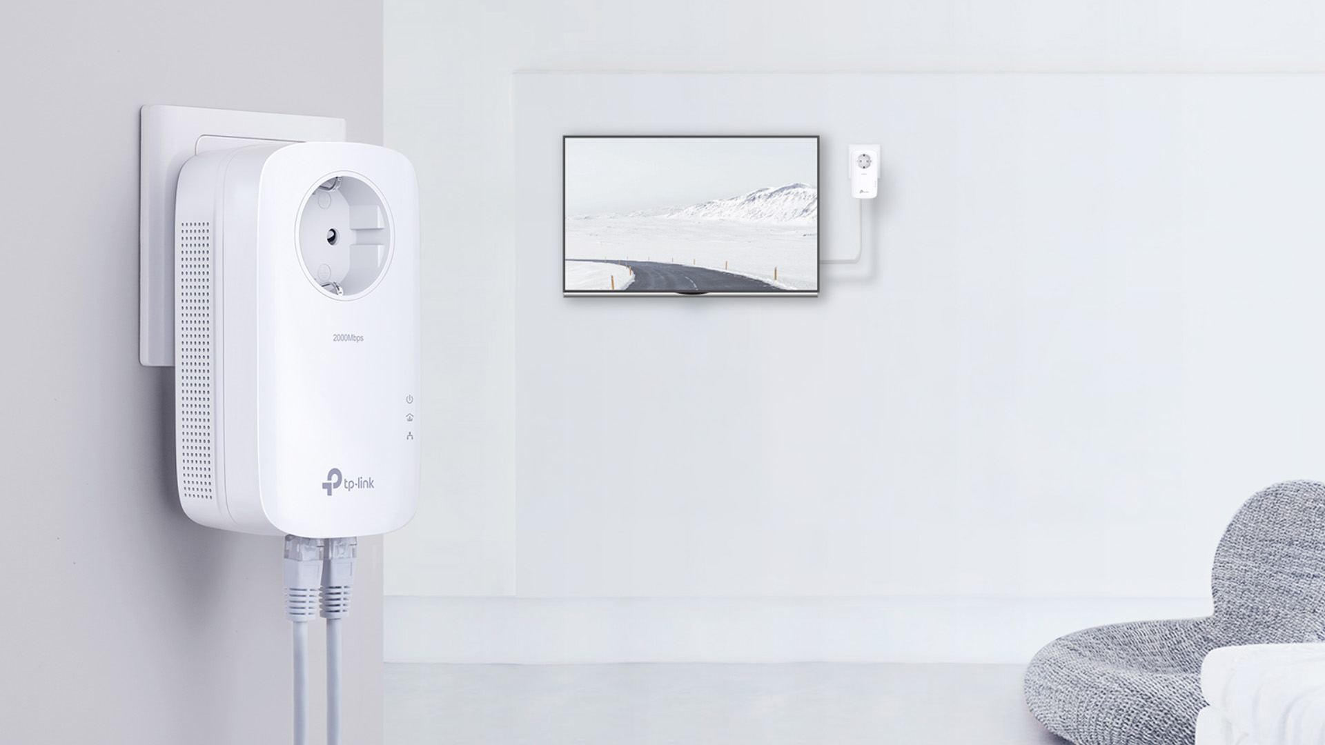 A TP-Link powerline adapter with multiple ethernet ports plugged into a wall socket.