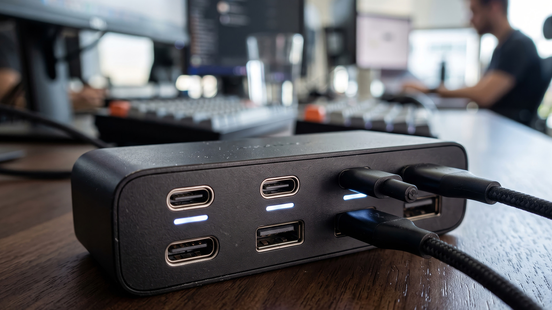 USB-C docking station connected to peripherals on a desk.
