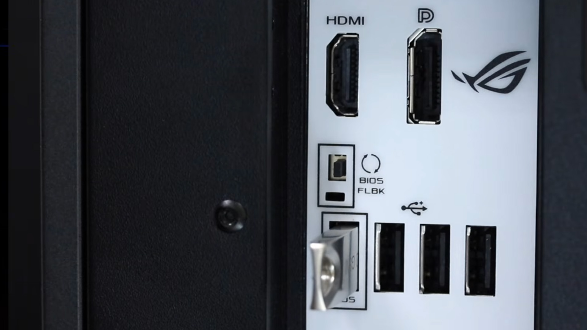 Close-up view of a USB flash drive plugged into the dedicated BIOS flashback port on a motherboard.
