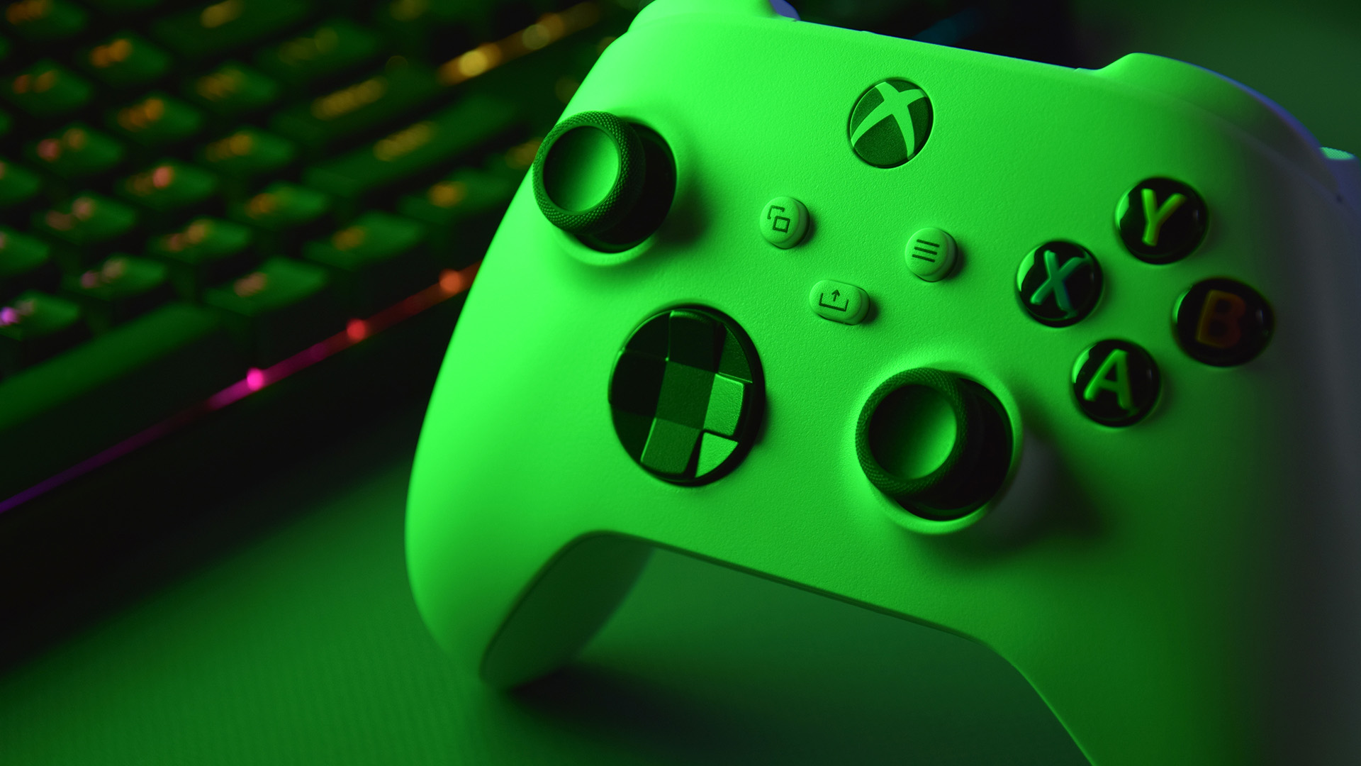 White Xbox wireless controller glowing with green lighting.