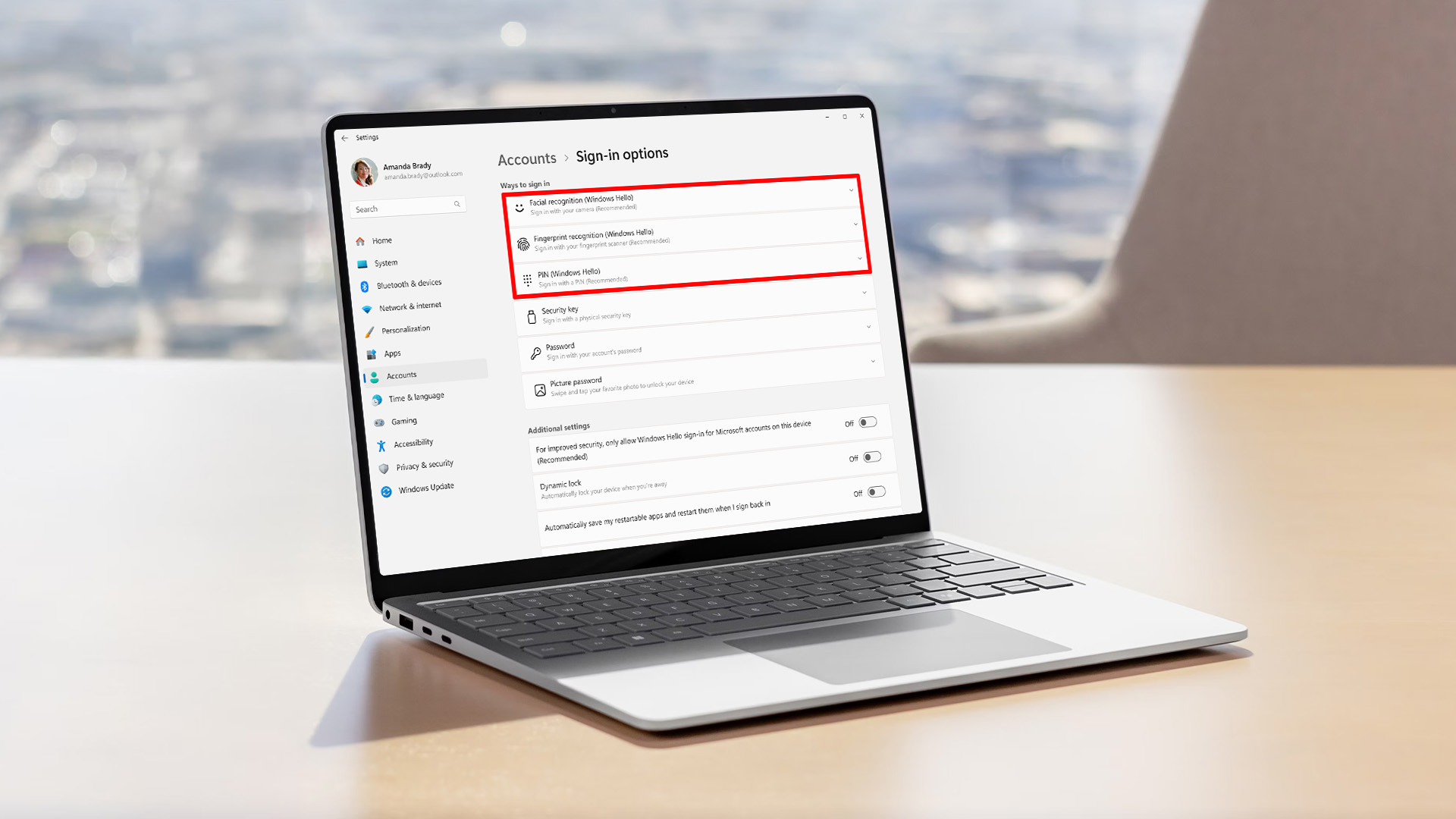 A laptop displaying Windows 11 account sign in settings menu.