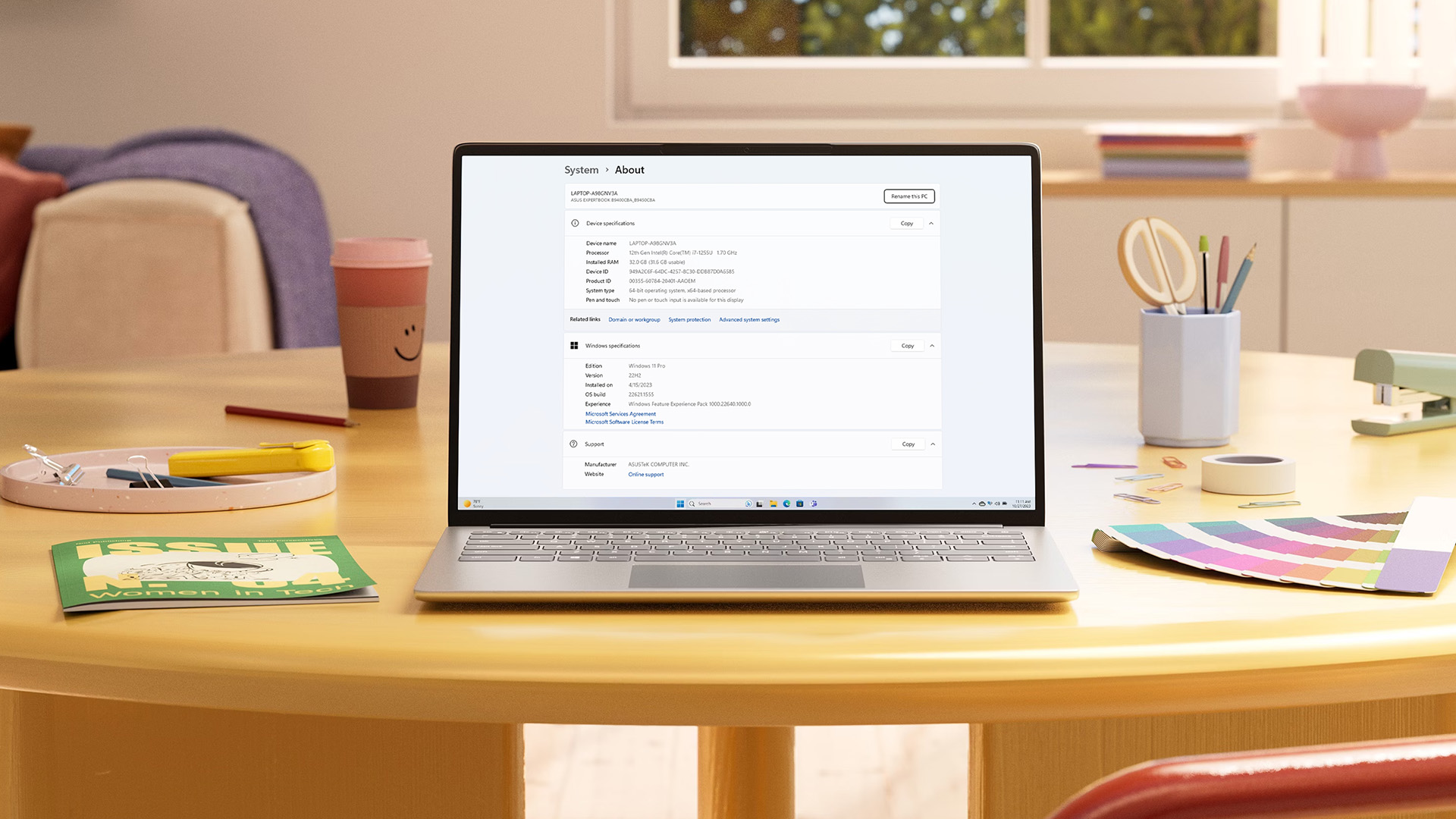 A laptop screen displaying the Windows 11 System About settings page with device specifications.