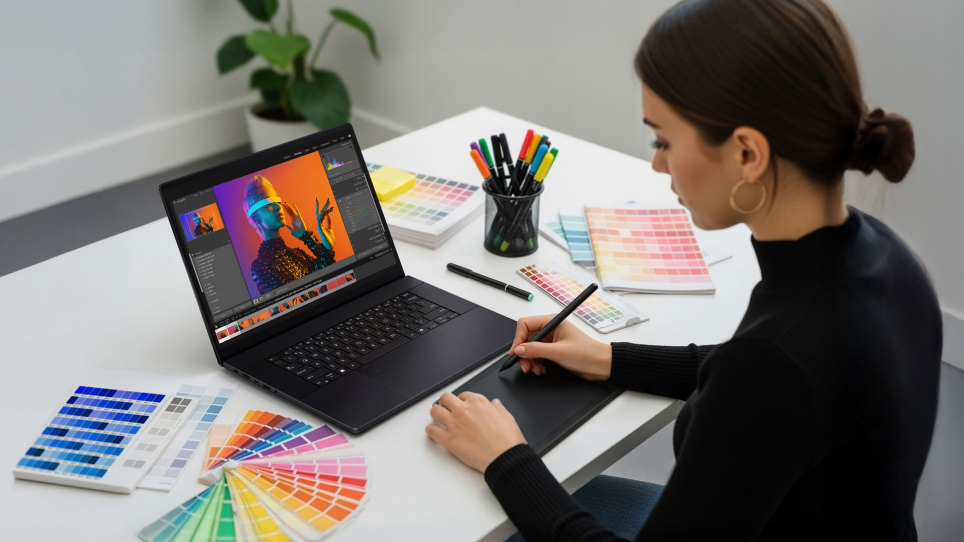 Woman using a graphic tablet and OLED laptop to edit a bright, colorful portrait.