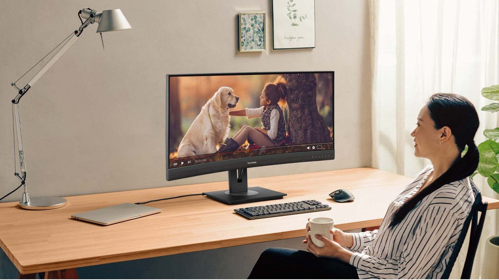 Woman watching a video on a monitor.